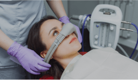 Woman getting sedation at the dentist